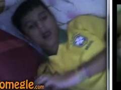 Small Latin boy jerks off his cock before going to sleep